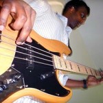 Raja playing bass guitar